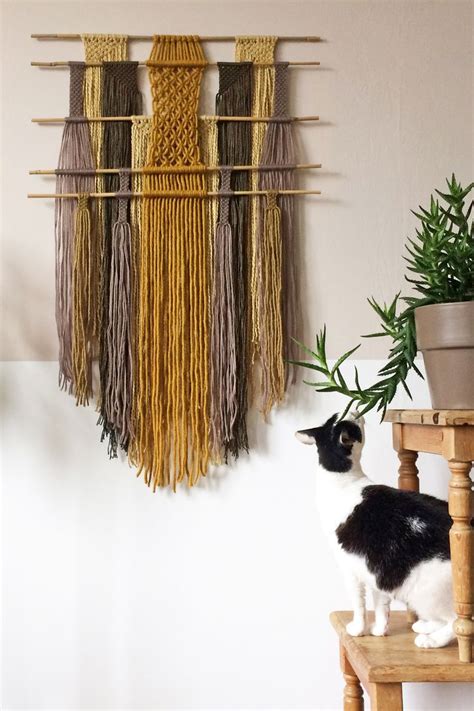 This is an easy to follow tutorial with clear steps and photographs. Macrame Wall Hanging with Bamboo Dowels | Fiber Art | Boho ...