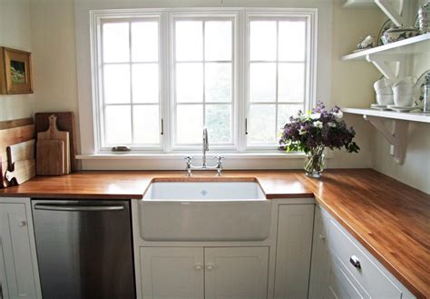 Wood countertops attract homeowners with the promise of a natural aesthetic. I would love to have these butcher block counters and that farmhouse sink in my kitchen ...