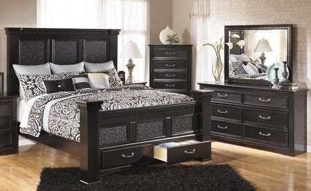 Replicated black paint with a subtle decorative pattern accenting some of the panels; Signature Design by Ashley B2913135150157164S9846 ...
