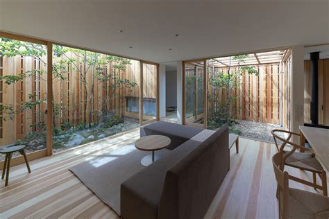An Unconventional Wooden Home Structured Around Three Internal