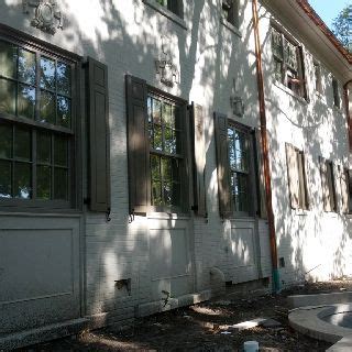 Performing adjustments to a marvin window or. The shutters are up and match Marvin Windows' Pebble Gray ...