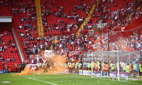 Charlton Fans Throw Flares Onto The Pitch As They Protest In The