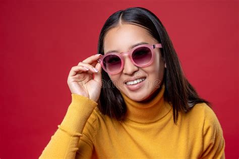smiling happy girl touching the rim of her sunglasses stock image image of smiling glasses