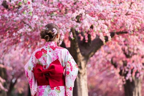 premium photo asian woman wearing kimono with cherry blossoms sakura in japan