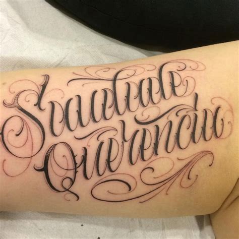 A Tattoo With The Words Squadron Over It On Someones Arm In Black Ink