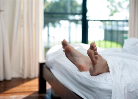 Free Image Of Bare Male Feet Protruding From The End Of A Bed