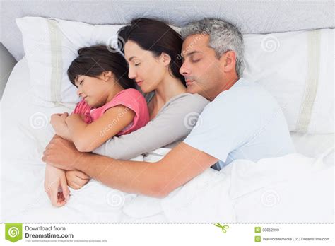 Parents Sleeping With Their Daughter In Bed Stock Image Image Of