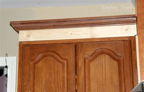 That was the case with these mouldings on our kitchen cabinets. Adding height to the kitchen cabinets | tempting thyme