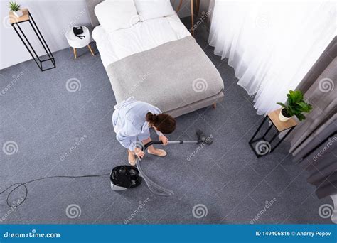 Housekeeper Cleaning Carpet With Vacuum Cleaner Stock Photo Image Of