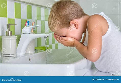 Boy Wash The Face In The Bathroomthe Beginning Of A New Day Stock