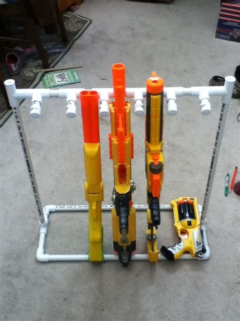 No more nerf darts and guns lying everywhere. DIY Nerf Gun storage rack. PVC pipes. Only around $20 for ...