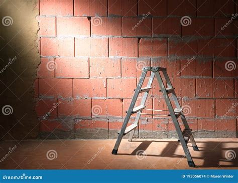 Step Ladder In Front Of A Brick Wall From Porotherm Style Blocks Partly