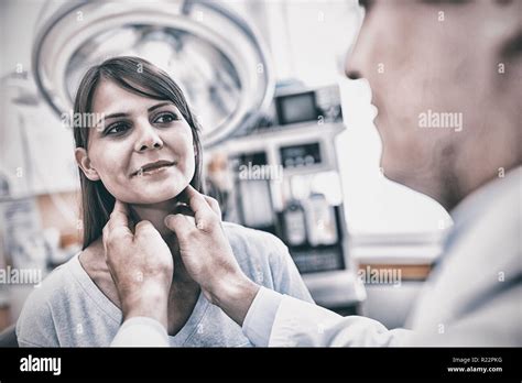 Doctor Examining A Female Patients Neck Stock Photo Alamy