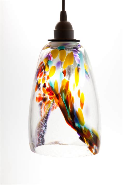 The argentum storm blue glass pendant light is a handcrafted blown glass pendant in luminous blue and ivory color by studio zayante. Hand Blown Glass hanging light pendant fixture in Yellow