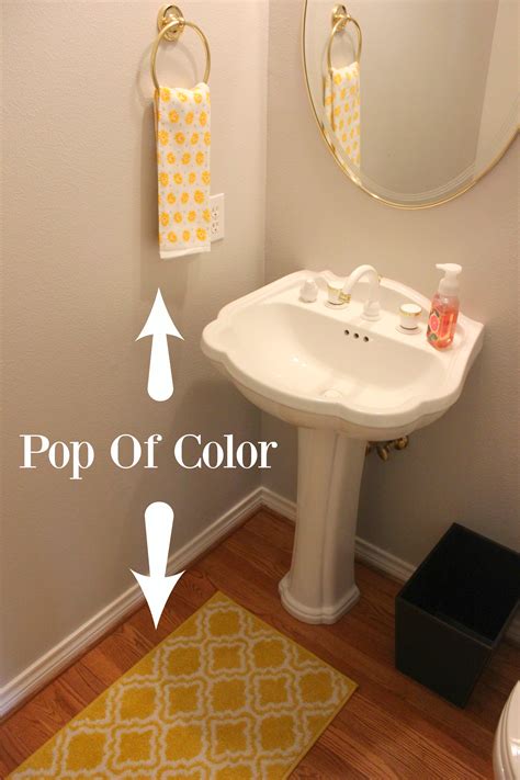 A standing, decorative toilet paper holder will take a minimal amount of space and double up as a decorative piece. How To Decorate A Half Bath | Budget Savvy Diva
