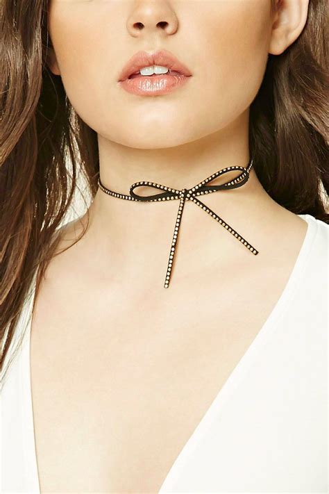 A Faux Suede Choker Featuring A Bow Accent High Polish Beaded Design