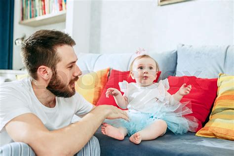 Proud Father Holding His Baby Daughter At Home Stock Image Colourbox