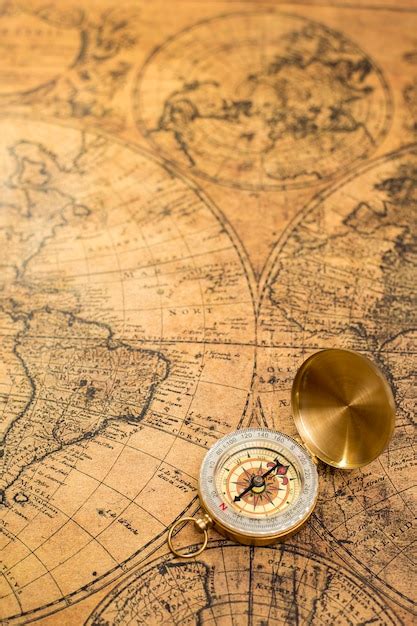 Premium Photo Old Compass On Vintage Map