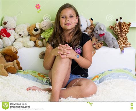 Cute Little Girl Sitting On The Bed Stock Image Image Of Smile Room