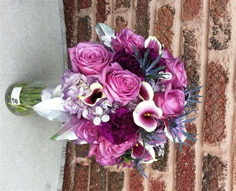 wedding bouquet with picasso calla lilies moon series purple carnations cool water roses
