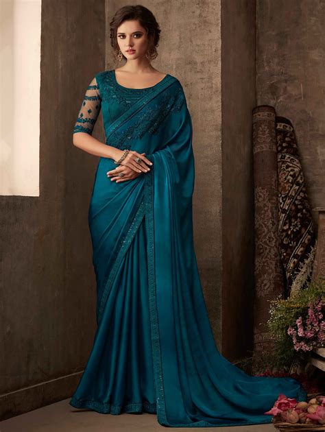 dark teal blue designer silk saree with embroidered border in 2020 blue silk saree party wear
