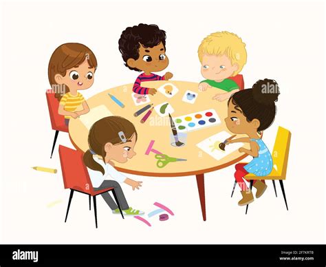 Multicultural Multi Aged Boys And Girls Sit At A Round Table Playing