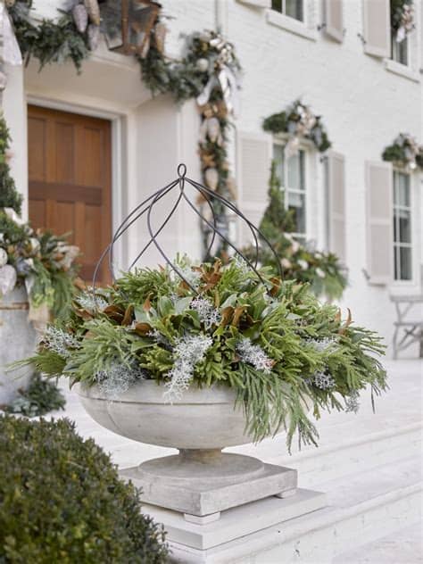 Add big and small glass candle holders and leave it on your porch. Outdoor Holiday Decorating: Home for the Holidays Showcase