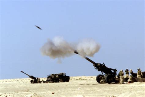 A 155 Mm Artillery Shell Hurtles Out Of The Barrel Of A 11th Marine