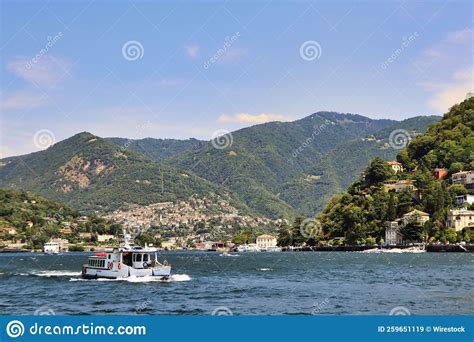 Scenic View Of Lake Como With A Boat And Shoreline Mountain Forests And