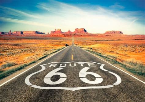 An Open Road With The Word Route 66 Painted On It