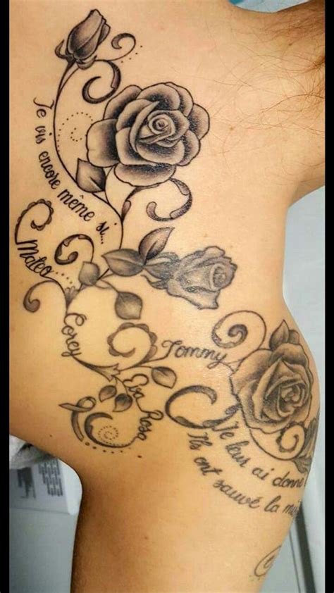 Flower tattoos are both meaningful and gorgeous to look at. rose back and shoulder tattoo with kids' names | Rose ...