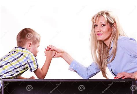 Mother And Son Arm Wrestle Sit At Table Stock Photo Image Of Rival