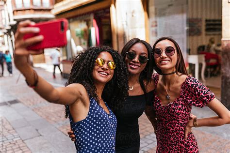 Brown Skinned Women In A Vintage Dresses Taking A Selfie On The Del