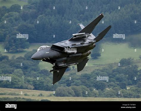 Usaf F 15e Strike Eagle Flying Low Level Through The Mach Loop In Wales