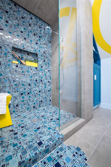 Blue Mosaic Tile Spills From Shower Onto Floor To Create Pooling Effect