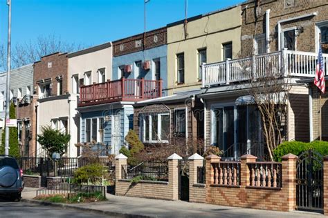 A Row Of Beautiful Old Homes Along The Sidewalk In Astoria Queens New