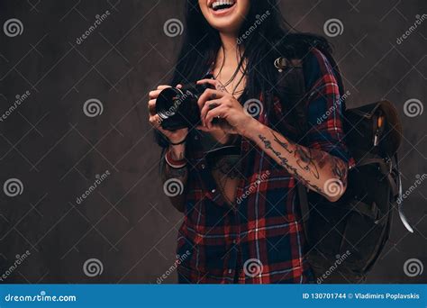 Tattooed Hipster Girl Wearing A Red Unbuttoned Checked Shirt Holding A