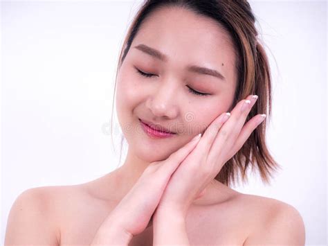 Beautiful Young Asian Girl With Clean Fresh Skin Touch Own Face Cosmetology Beauty And Spa