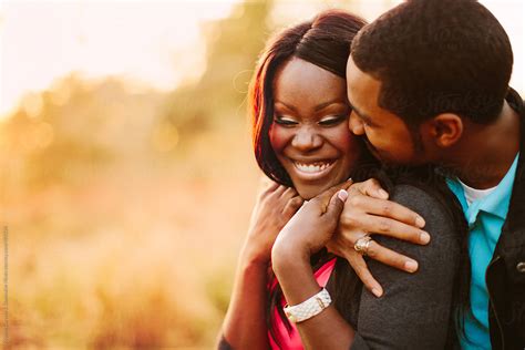 Affectionate And Happy Black Couple Together Outdoors By Kristen