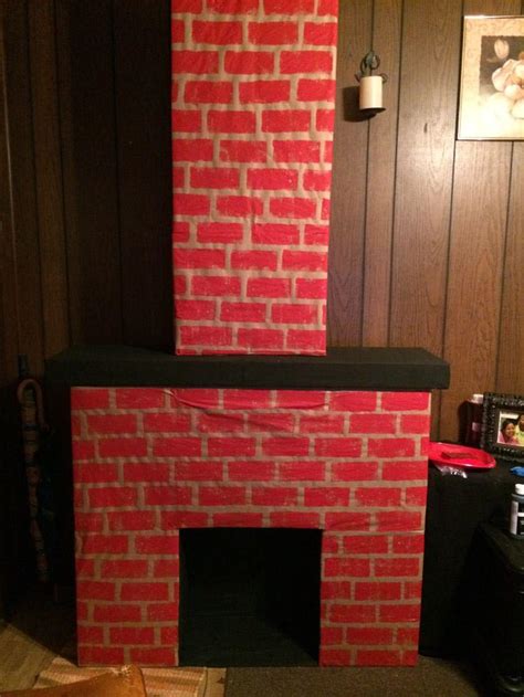 Easy video tutorial of how to make a fake fireplace with flickering ember out of a box and baking paper! Fake Fireplace | Fireplace Designs