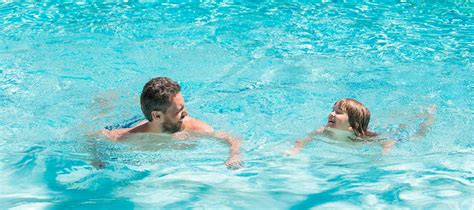 Premium Photo Father And Son In Swimming Pool Banner With Copy Space Summer Holidays Weekend