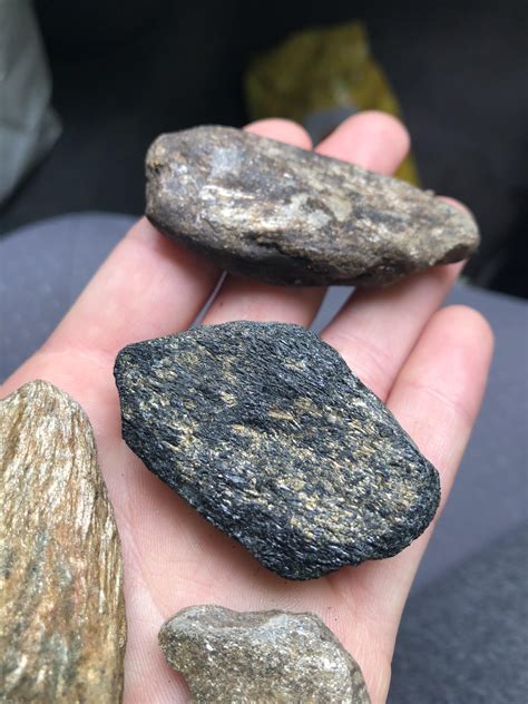 Black Rock With Gold Colored Specks Found Along A River In Northern
