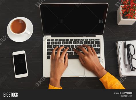 Black Female Hands Typing On Laptop Top View Of African American Woman