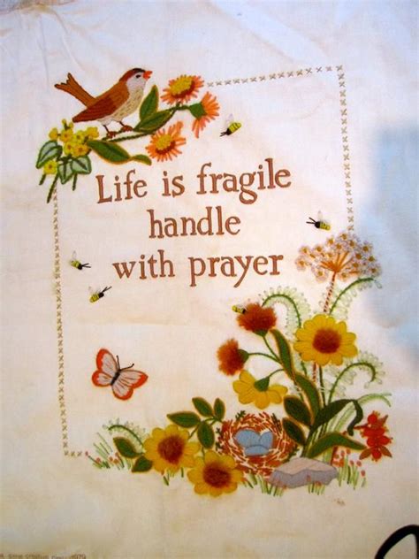 Human spirit is the ability to face the uncertainty of the future with curiosity and optimism. Life is Fragile Handle with Prayer LARGE embroidered artwork