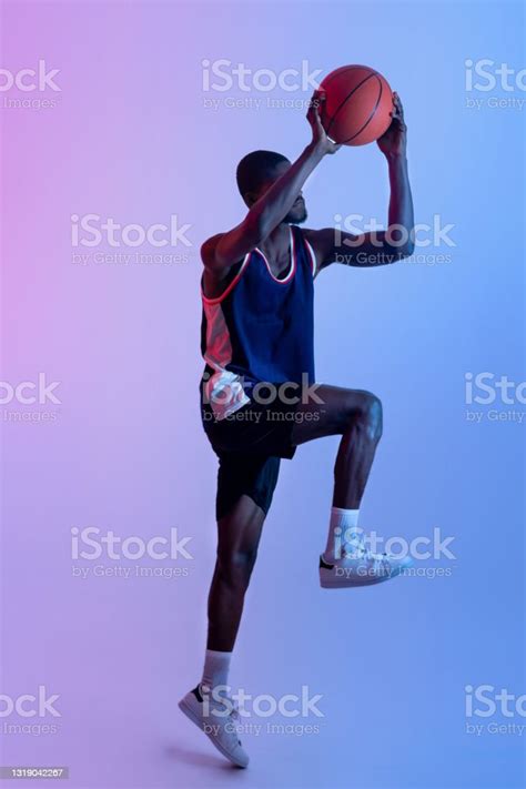Full Length Portrait Of Professional Black Basketball Player Jumping
