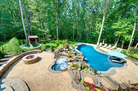 Precision Pool With Custom Waterfalls And Hot Tub Rustic Swimming
