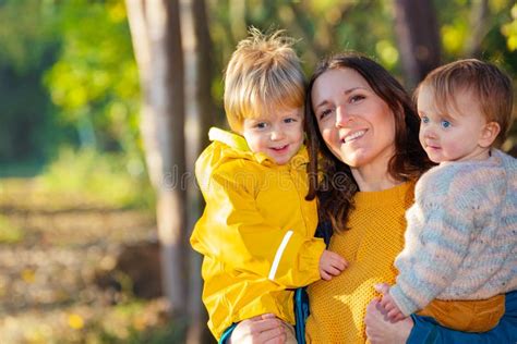 Happy Mother With Her Son And Daughter In Forest Stock Photo Image Of