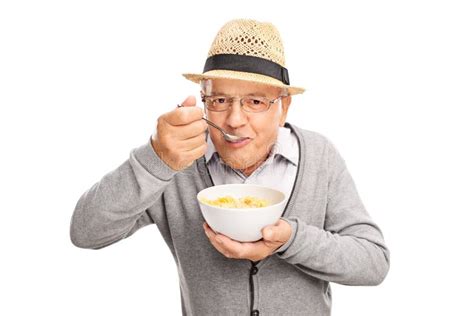 Senior Man Eating Cereal With A Spoon Stock Image Image Of Looking