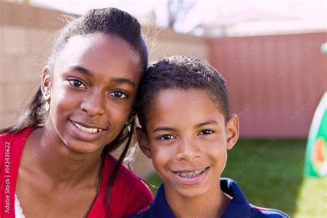Happy African American Brother And Sister Smiling Stock Photo Adobe