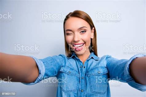 Self Portrait Of Crazy Foolish Girl Shooting Selfie With Two Hands On Front Camera Gesturing